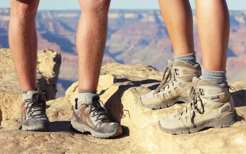 Hiker wearing hiking shoes and a hiker wearing hiking boots