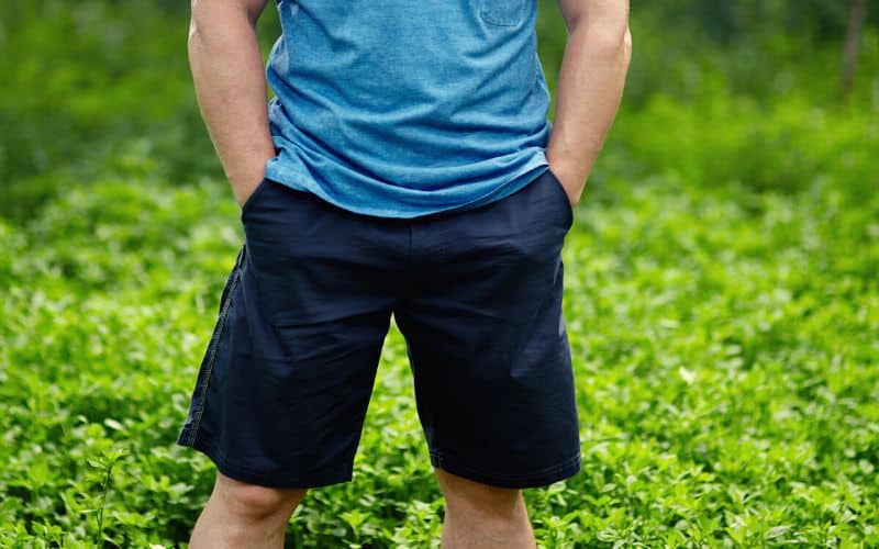 Man with his hands in his shorts pockets