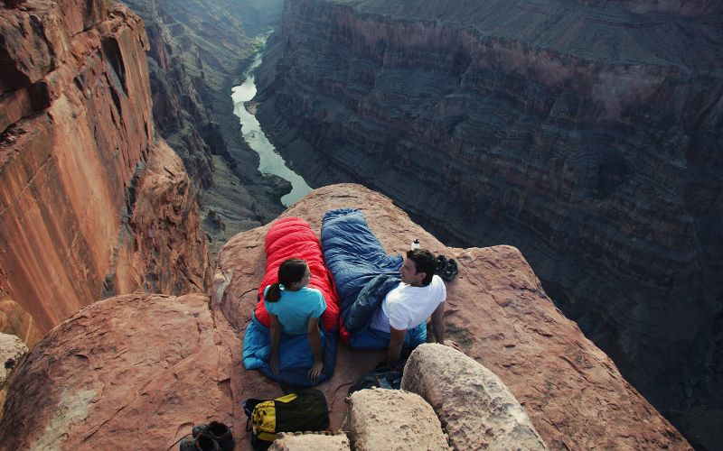 Couple of campers in mummy style sleeping bags