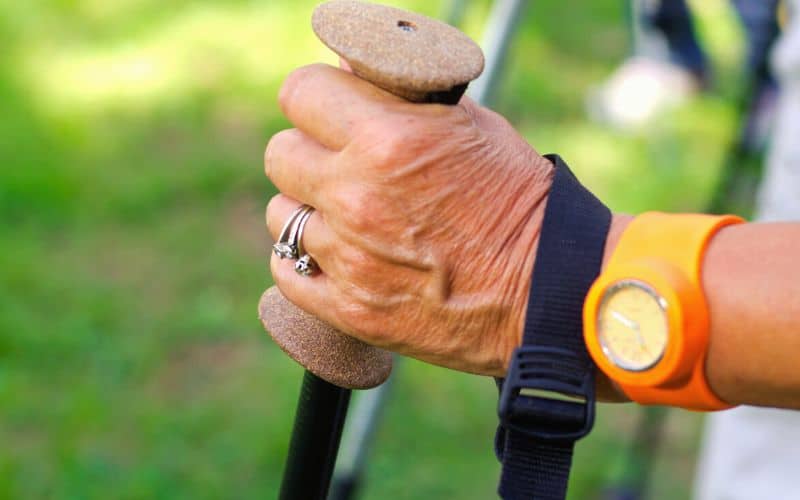 Hiker holding a cork handle on a trekking pole