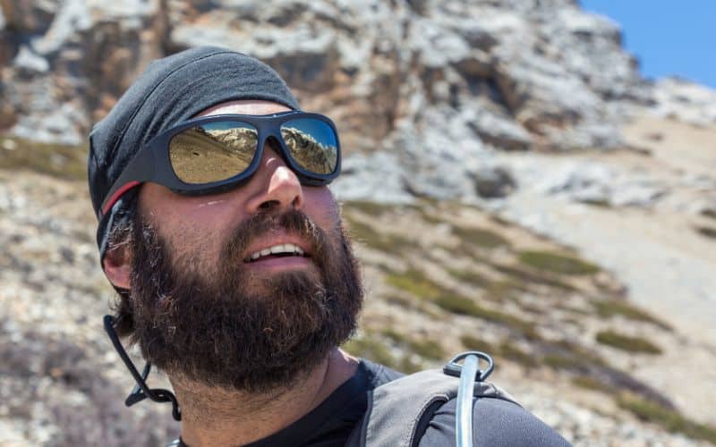 Hiker on sunny day wearing sunglasses