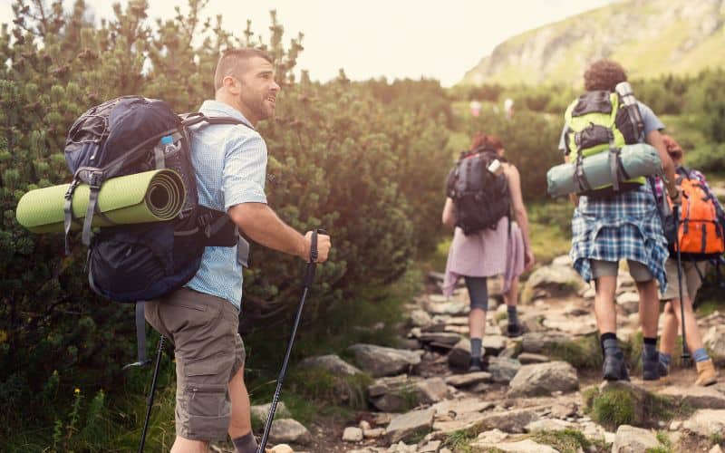 Hikers on hot day wearing light, loose clothing
