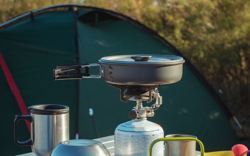 Skillet with lid atop of a camp stove