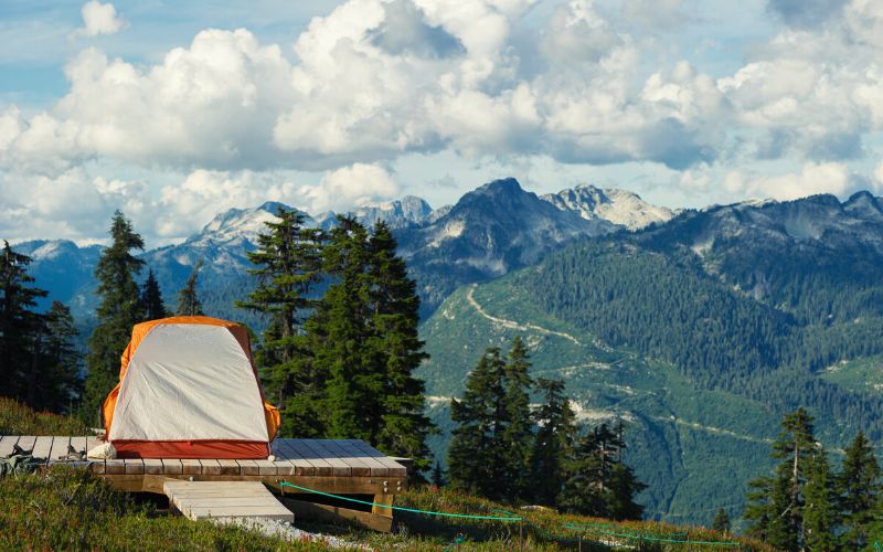 Tall tent pitched in mountains