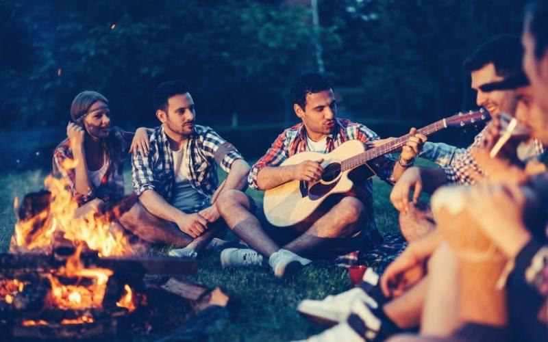 group of campers enjoying music