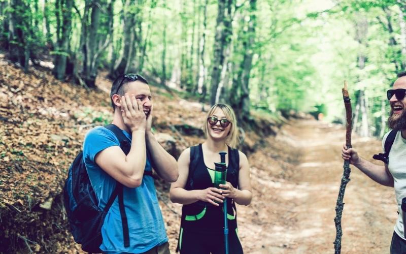 hikers smiling and laughing in the trail
