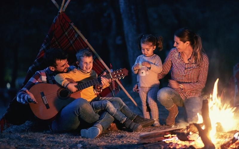 kid playing the guitar