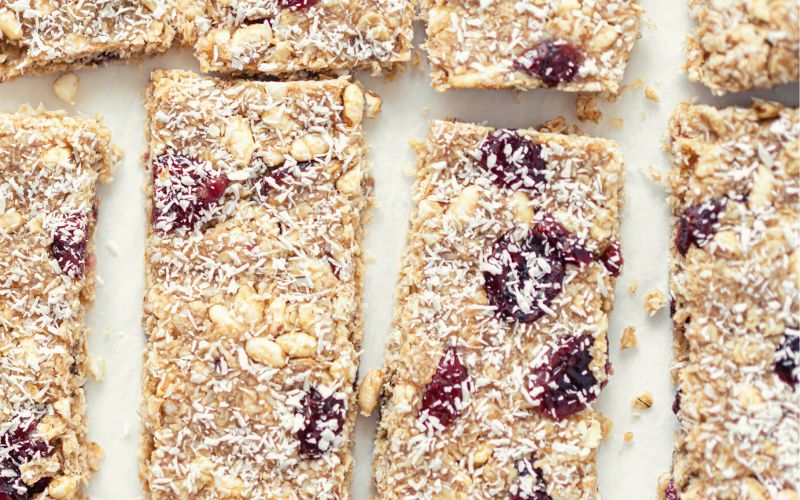 Peanut Butter & Jelly Granola Bars with coconut flakes