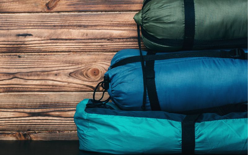 Pile of sleeping bags in their stuff sacks
