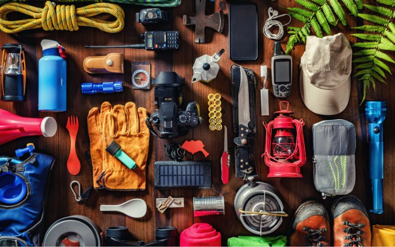 Table full of various hiking and backpacking gear items