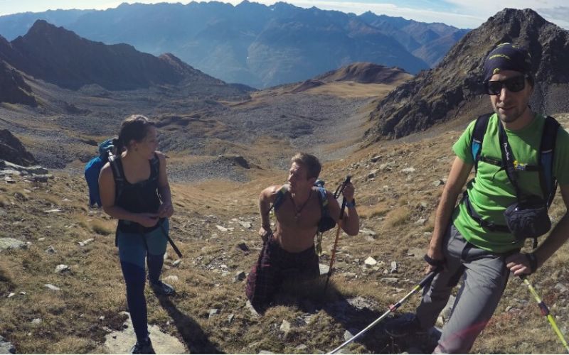 Three hikers, one in pants, 1 in leggings and 1 in a kilt