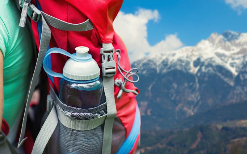 backpack with water bottle in side pocket