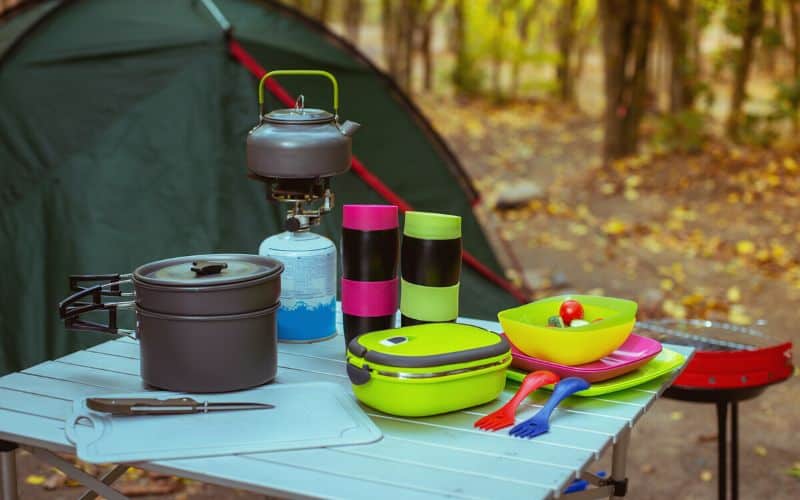 Camp kitchen gear laid out on a table