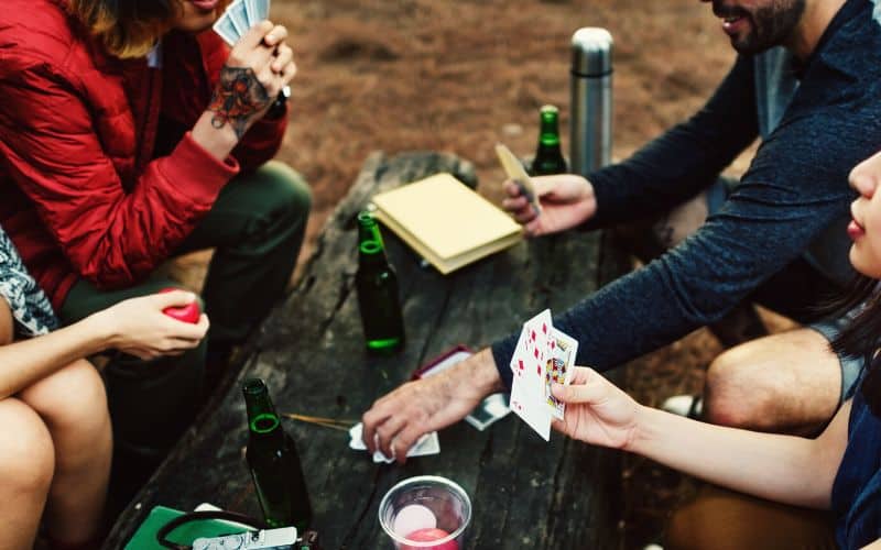 Campers playing a card game