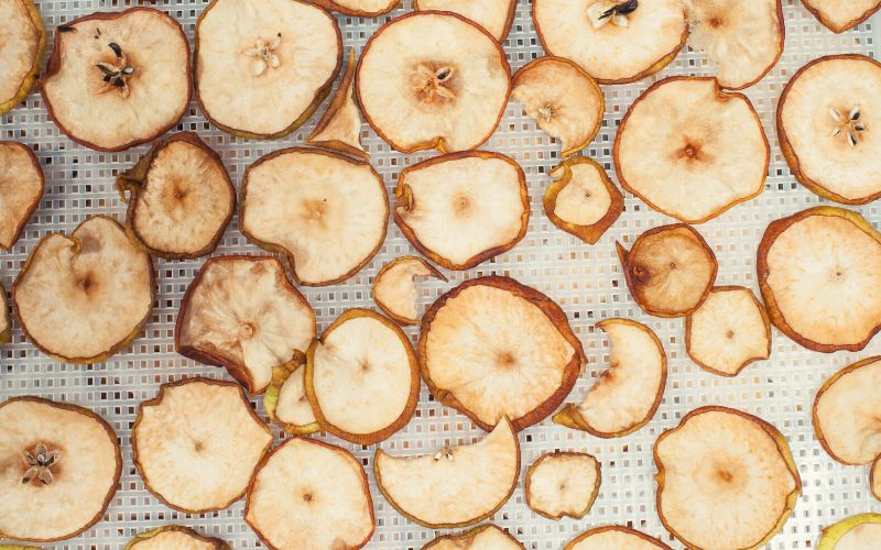 Dehydrated apples an pears on dehydrator tray
