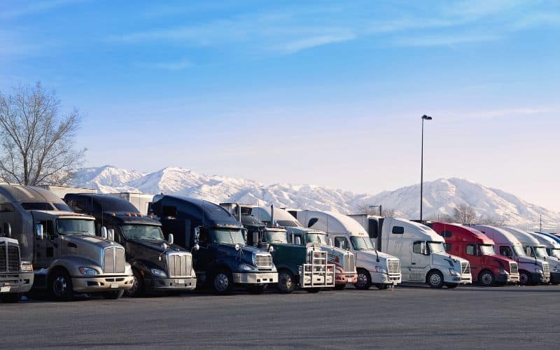 Highway truck stop with snowy mountains in the background