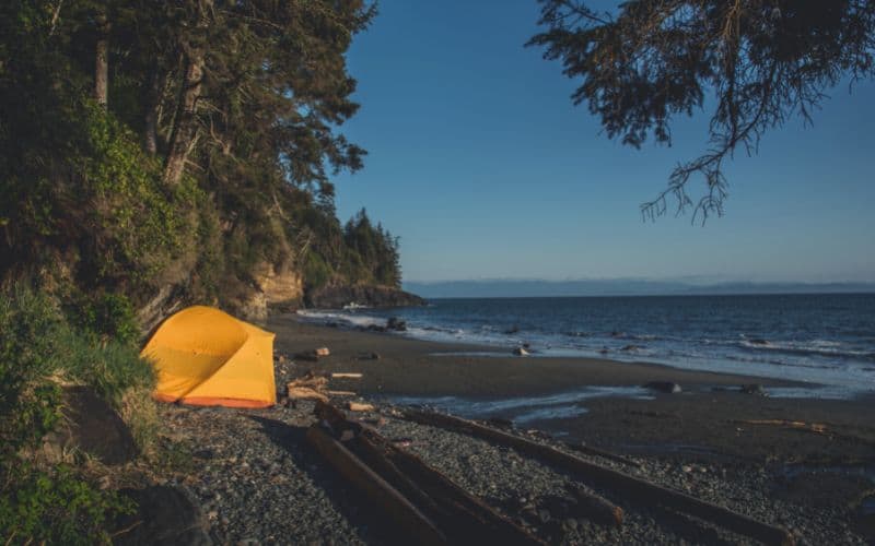 Tent camping on lake shore in Canada