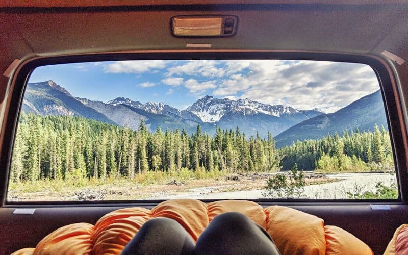 View out of back parked car at mountains in British Columbia, Canada