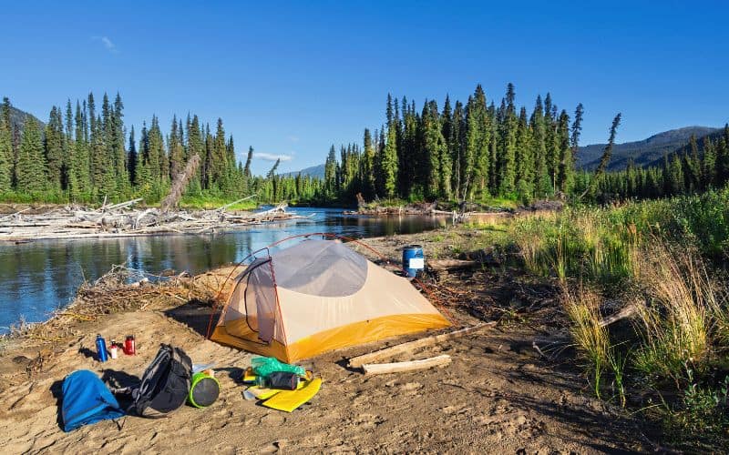 Wilderness camping with a tent pitched on a beach in Yukon, Canada