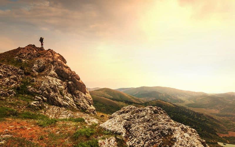 Lone hiker on a mountaintop