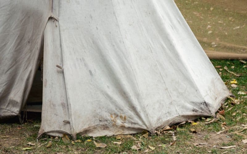 Bottom of a canvas tent showing muddy stains