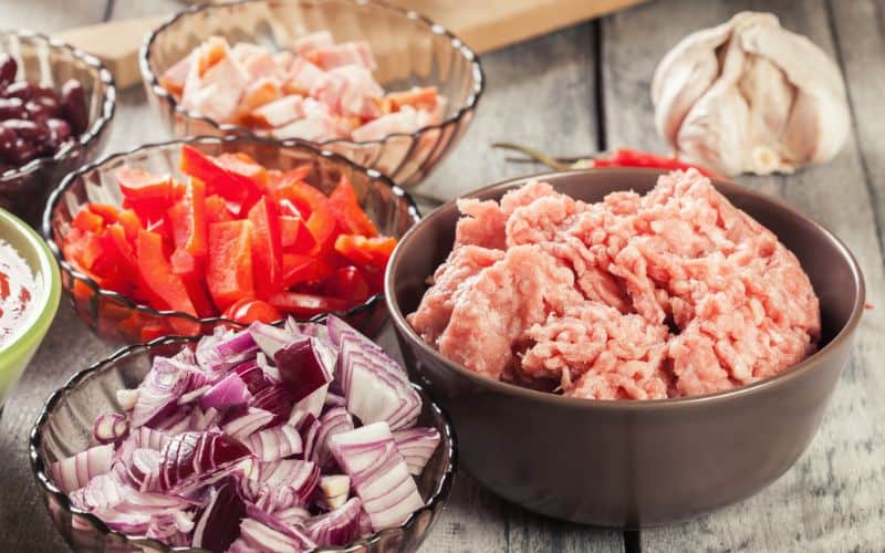 Chili con carne ingredients laid out on table