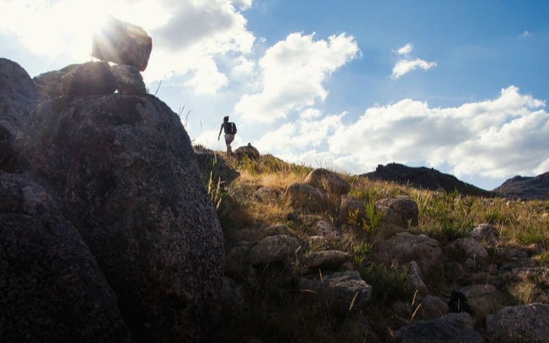 Person hiking up steep mountain