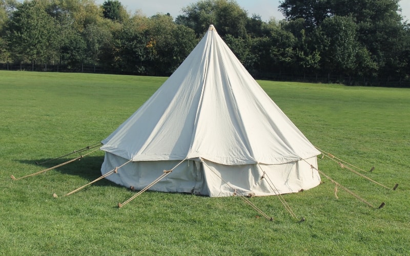 canvas tent pitched in yard