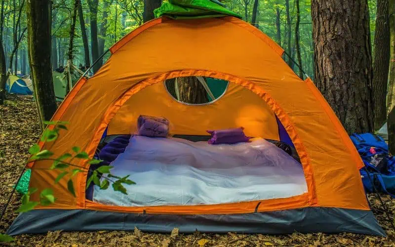 Double air mattress inside an orange tent
