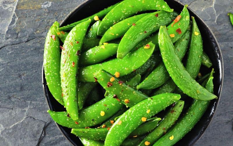 Bowl of seasoned sugar snap peas 