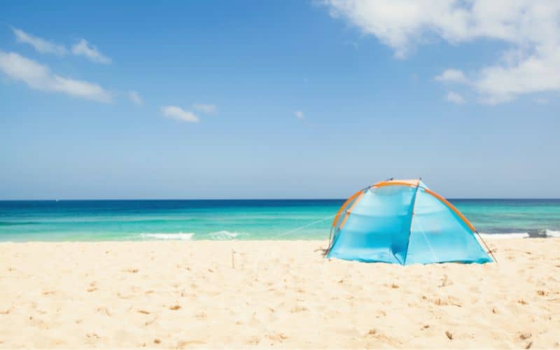 Tent pitched on a sandy beach
