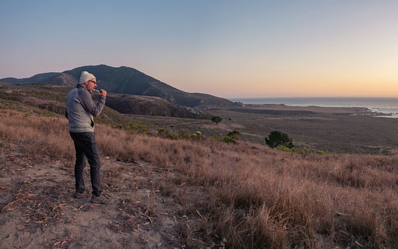 Man brushing teeth in the wilderness