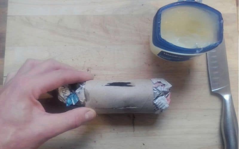 Slits cut into toilet roll stuffed with fire starting material