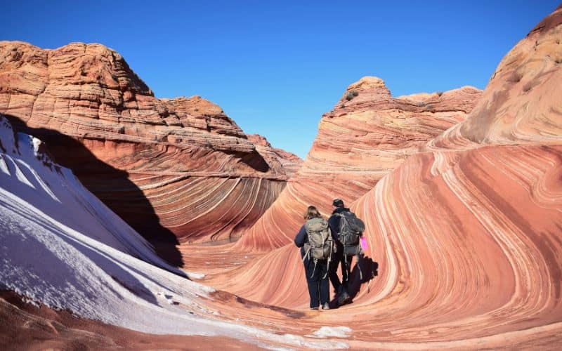 Two hikers at The Wave, Arizona in winter