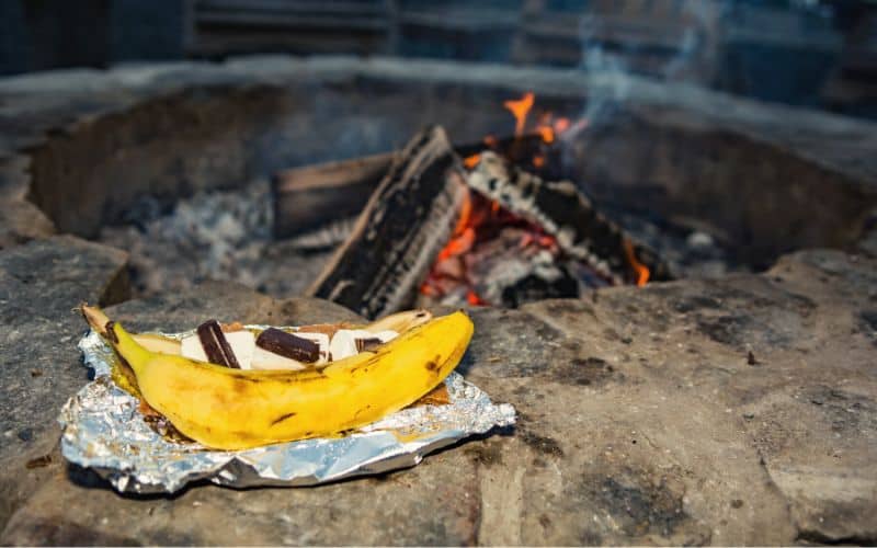 Banana boat s'mores in foil ready to heat up on campfire