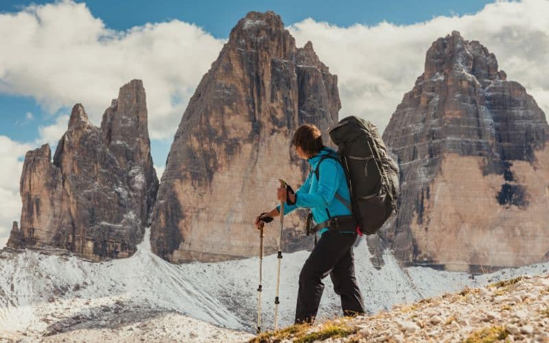 Woman backpacking in the Dolomites, Italy
