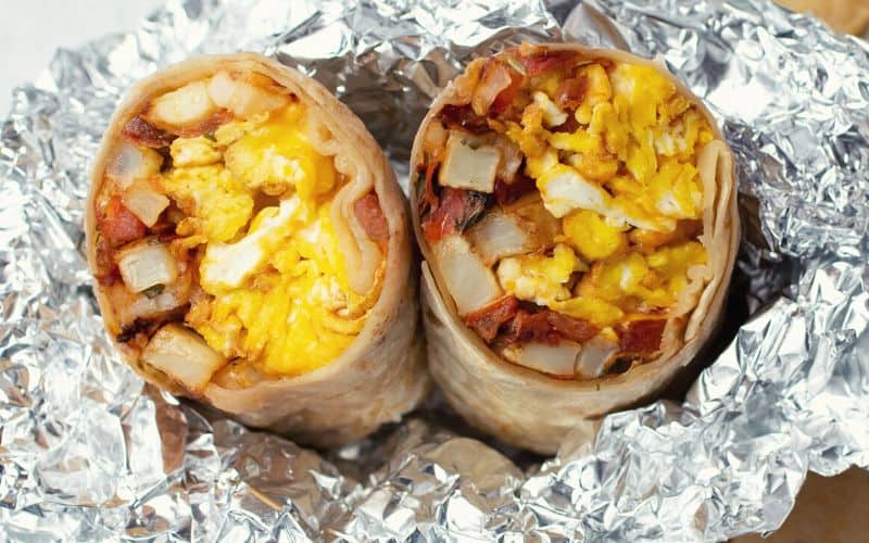 Close up of a breakfast burrito in foil