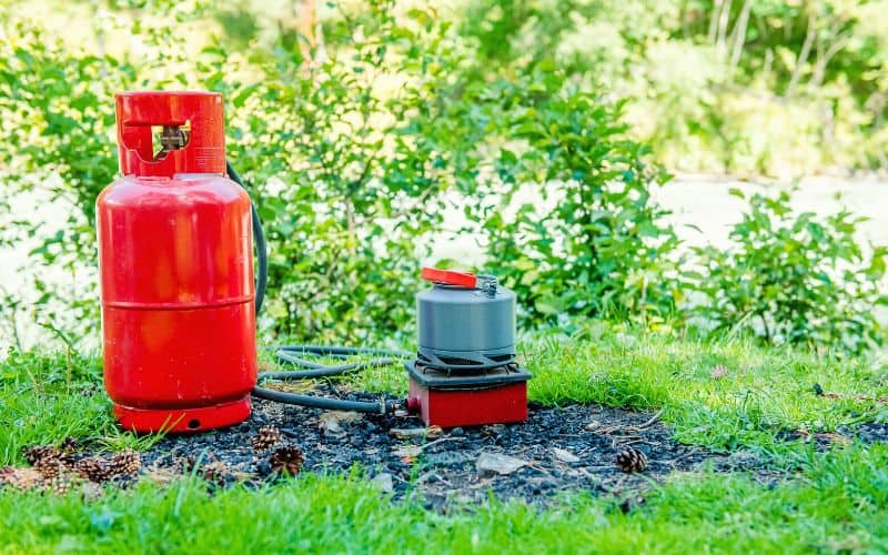 Camping stove attached to large propane gas tank