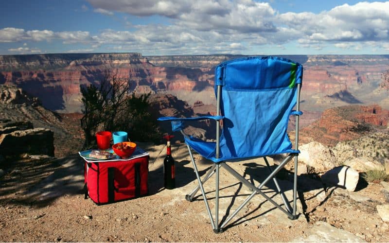 Soft sided camp cooler and camp chair  at the edge of the Grand Canyon